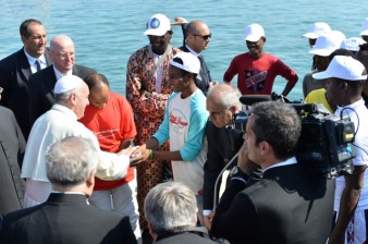 Pope Francis greets immigrants as he arrives at port in Lampedusa